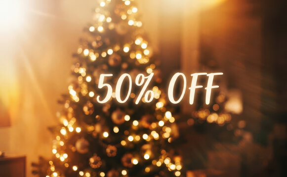 Christmas tree with glowing lights and fifty percent off text for holiday sale banner and promotion advertising