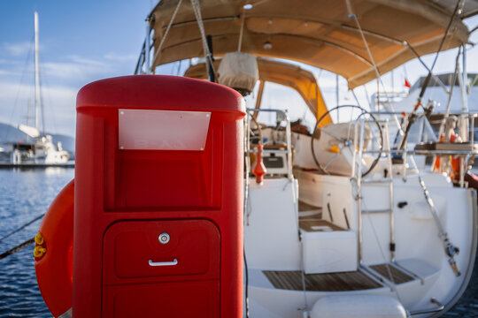 yachts docked in modern marina with shore power and water pedestals