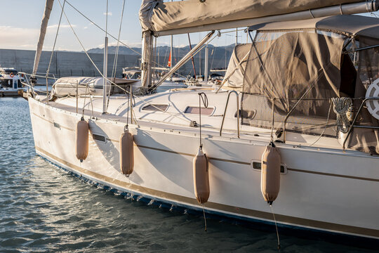 yachts docked in modern marina with shore power and water pedestals