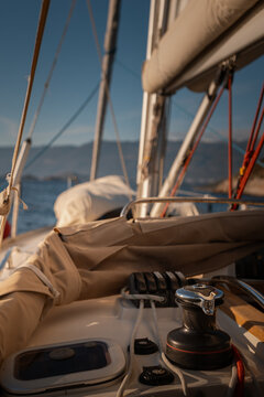 View from cockpit of sailing yacht heeling in open sea during summer travel