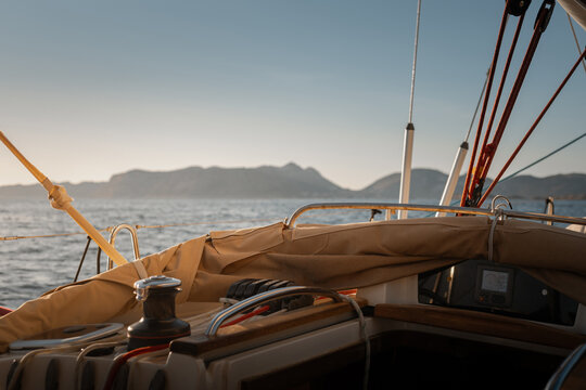 View from cockpit of sailing yacht heeling in open sea during summer travel
