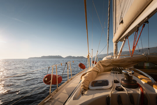 View from cockpit of sailing yacht heeling in open sea during summer travel