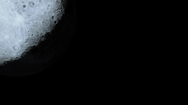 The moon with visible craters and surface details against a dark sky. The image captures a clear moment during the night when the moon is fully illuminated.