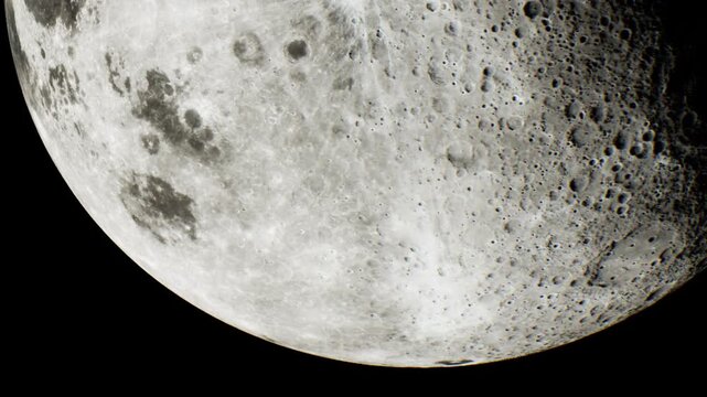A close view of the moon shows its surface features and craters against a dark night sky. This view highlights the textures and structures of the moons surface.