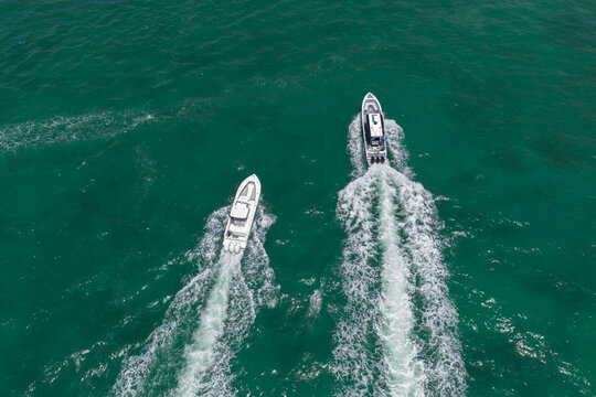 Luxury boat yachting. Motorboat sailing at sea. Luxury charter yacht in sea. Motor yacht luxury vessel. Sea motor boat. Sea summer vacation. Aerial motorboat. Yacht boat tour. Coastal luxury