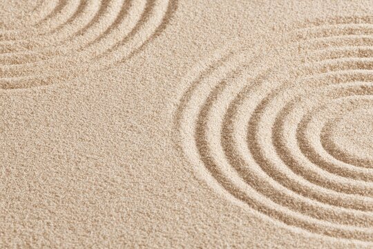 Zen garden sand pattern with concentric circles for meditation and tranquility