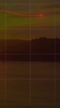 Red data points and lines animation over sunset landscape with water and hills
