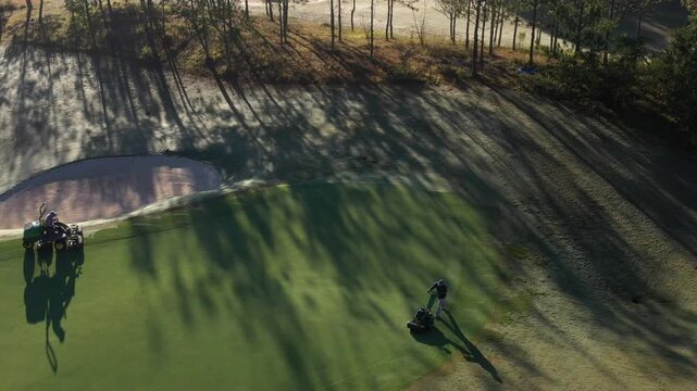 Aerial drone view of SAM Tuyen Lam Golf Club in Da Lat, Vietnam, showcasing lush fairways surrounded by pine forests and mountain scenery in the scenic Tuyen Lam Lake area.