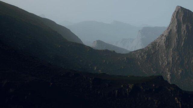 Mountains are shown with different shapes and heights in a quiet setting. Shadows cover parts of the ground. Light creates a soft look on the rocks and hills during low light hours.
