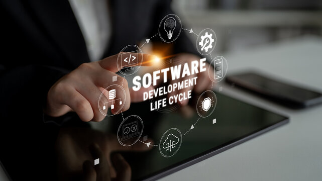 Conceptual representation of software development life cycle with digital icons and hand gesture interacting with tablet on modern office background Quark.