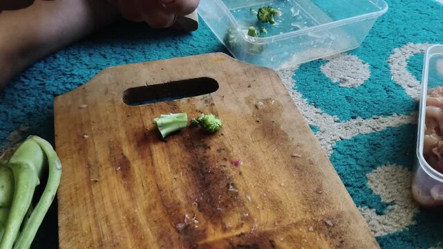 Minimalist kitchen shot focusing on a rustic cutting board surface in daylight