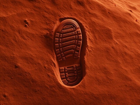 Footprint in red sand, closeup of sole tread in desert terrain, textured background with human trace