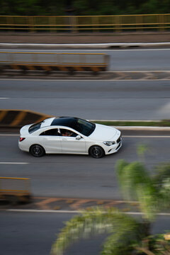White Mercedes-Benz CLA Driving on Highway, High Angle View