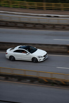 White Mercedes-Benz CLA Driving on Highway, High Angle View