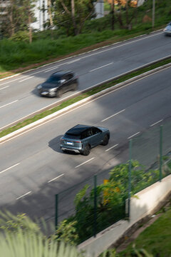 High Angle View of Grey Land Rover Range Rover Velar Driving on Urban Road