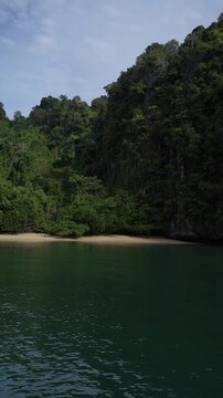 Sailing towards tropical paradise island beach