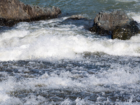 Rushing River White Water Rapids Flowing Past Mossy Rocks