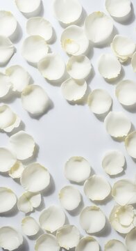 Elegant white rose petals scattered across a soft surface in a top down view, creating a delicate floral pattern for romantic backgrounds, decorative, fragrant, decor