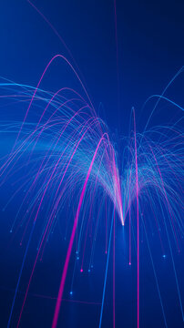 Dynamic vertical fountain of sparkling blue and pink fiber optic light trails with fountain vertical connection abstract firework explosion