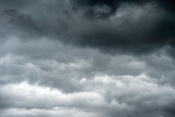 Obraz premium dark clouds sky black Heavy rain thunderstorm. Pattern clouds overcast tornado Hurricane cyclone typhoon storm and rainy. Dark cloudy have storm lightning thunderbolt. Hole in Dark Dramatic Clouds