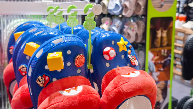 Super Mario Crocs Clogs Shoes Hanging on Retail Store Display Rack on July 27, 2026 in Bangkok,  Thailand 