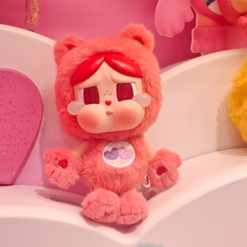 Cute Fluffy Pop Mart Crybaby Plush Doll Wearing Care Bears Style Bear Costume Figurine Display for Collector Concept on August 20, 2026 in Bangkok,  Thailand 