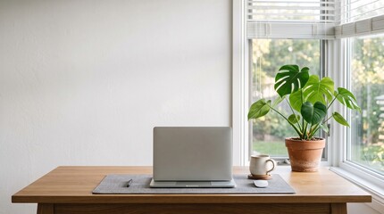Fototapeta premium Clean minimalist room interior with laptop on table and sunlight from window