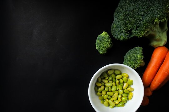 top view of fresh vegetables with cooy space on a black background
