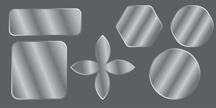 A collection of various metallic silver shapes including circles rectangles and a flower design on a dark background