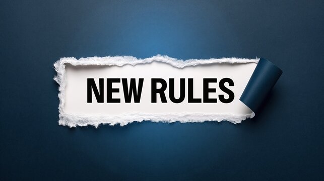 Torn paper revealing new rules text on blue