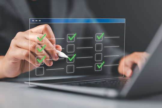Task management and scheduling software. To-do list for progress tracking. Businessperson using laptop computer to manage and prioritize tasks.