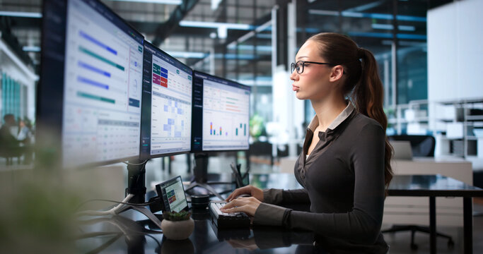 Young Woman Studies Financial Dashboard