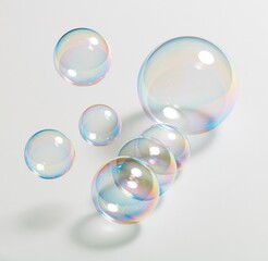 Obraz premium Colorful soap bubbles floating on white background