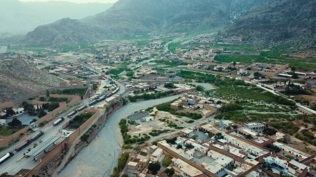 Aerial view of Landi Kotal village surrounded by rugged mountains in Khyber, Pakistan
Aerial landscape of Landi Kotal surrounded by rugged mountains traditional homes
Landi Kotal mountain landscapes