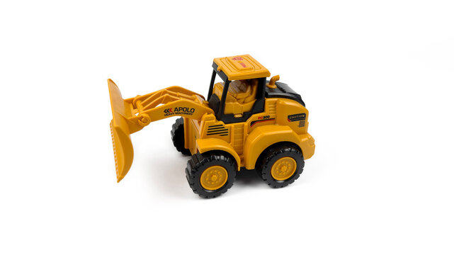 Kediri, East Java, Indonesia &ndash; August 26, 2026: Yellow Toy Bulldozer Model Displayed on White Background