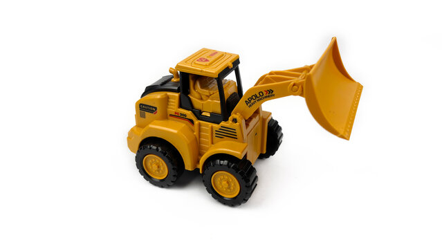 Kediri, East Java, Indonesia &ndash; August 26, 2026: Yellow Toy Bulldozer Model Displayed on White Background