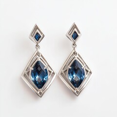 Fototapeta premium The image features a pair of elegant dangling earrings with a geometric design. Each earring has a small, diamond shaped element at the top, set with a dark blue gemstone