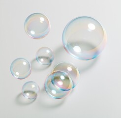 Obraz premium Colorful soap bubbles floating on white background