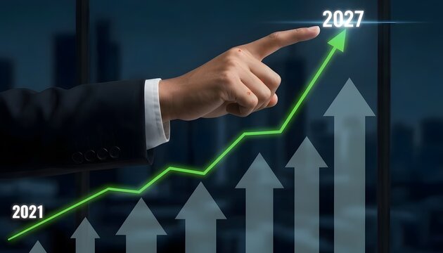 Businessman points at upward trending graph showing growth from 2021 to 2027
