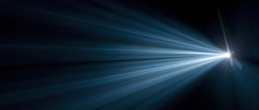 bright light beam shining across dark blue space