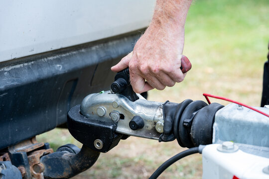 Hand Operating Trailer Hitch Coupling on Tow Ball