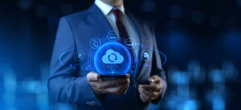 Businessman Holding smartphone with Cloud Computing Icons on Screen. Data transfer and Cloud Backup technology