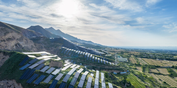 Solar power station on mountain slopes in the morning sunshine