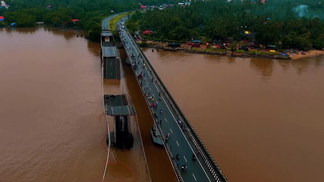 Aerial view of a bridge collapsed by a flood.
