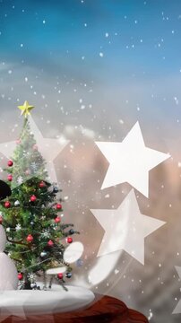 Animation of snow and stars over snow globe with christmas tree and snowman