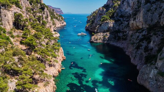 Aerial drone view of the calanques, also known as French fjords, winding bays with turquoise water among high cliffs. Provence, Alps, Cote dAzur, Marseille district, France. High quality 4k footage