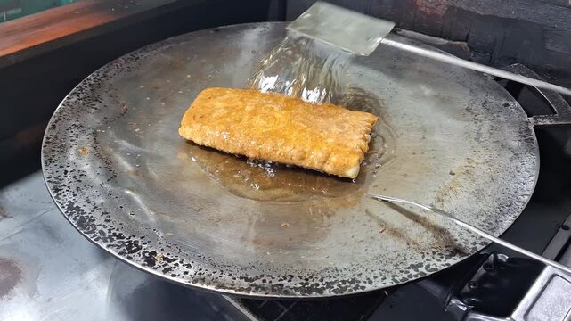 Footage of Martabak Telur Being Fried in Hot Oil