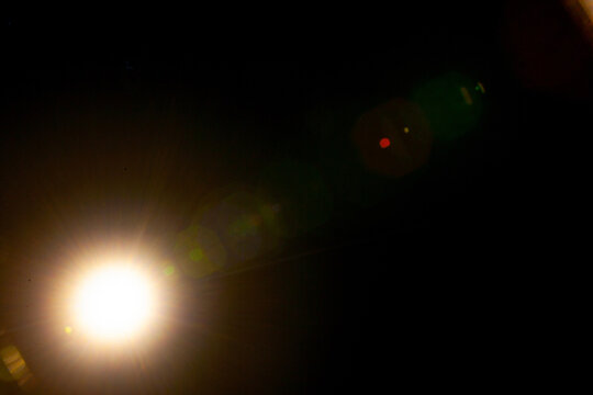 Sun flare on the black background
