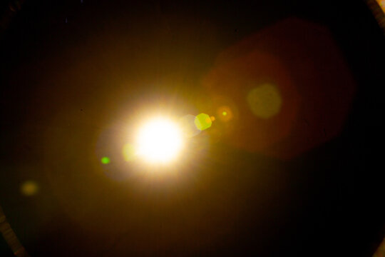 Sun flare on the black background