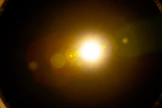 Sun flare on the black background